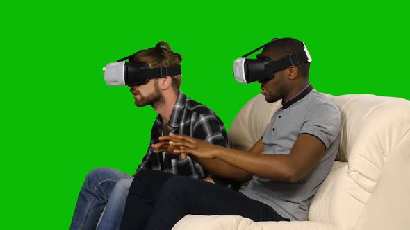 Men Shy Away From Something in VR Glasses. Green Screen alt