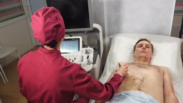 Abdomen Sonography Procedure. Top View of Male Patient Getting Ultrasound Scanning. Healthcare alt