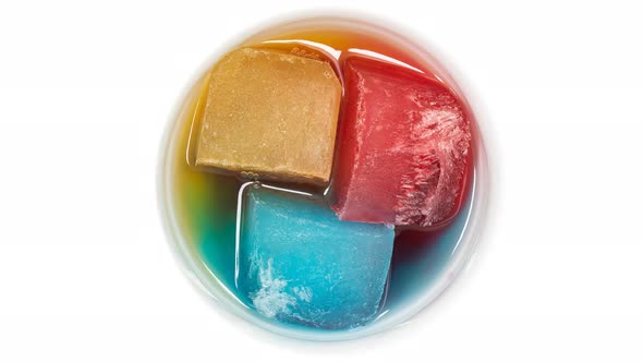 Ice of Different Colors Melting in a Bowl