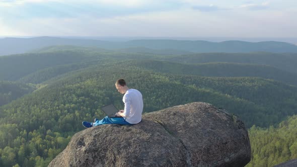 Circular Panorama of a Freelancer Working Outdoors in the Mountains. alt