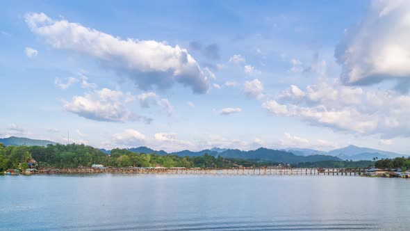 Mon Bridge, wooden bridge  in Sangkhlaburi during sunny day, Kanchanaburi, Thailand - Time Lapse