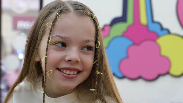 Portrait of a Beautiful Schoolgirl Girl on a Colorful Background alt