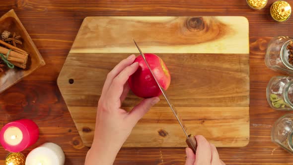 Woman Cutting Aplles Top View alt