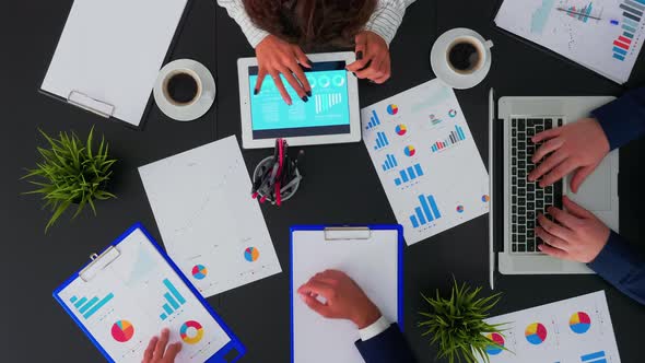 Business People Having Meeting Analysing Financial Statistics alt