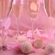 Falling confetti in the form of hearts on glasses with sparkling wine, round candy - VideoHive Item for Sale