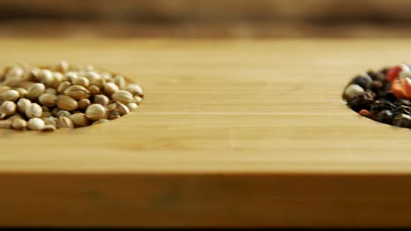 Various spices in wooden tray 4k alt