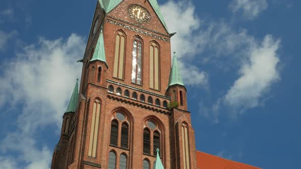 Aug 2020, Schwerin, Germany: View of the tall tower of Schwerin Lutheran Cathedral alt