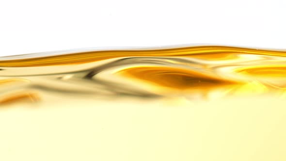 Super Slow Motion Shot of Moving Oil Waves Isolated on White Background at 1000Fps alt