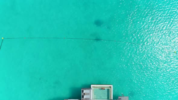 Aerial drone view of a luxury resort and overwater bungalows in Bora Bora tropical island alt