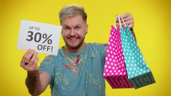 Cheerful Tourist Man Showing Shopping Bags and Up To 30 Percent Off Inscriptions Banner Black Friday alt