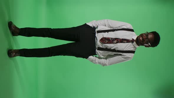 Portrait of Young African American Man Looking at Camera and Smiling Happily Showing White Teeth alt