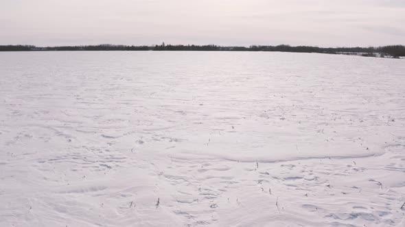 Drone shots of fields of snow alt