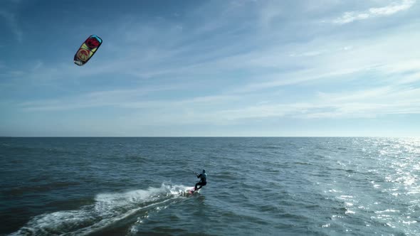 Kiteboarder Catching Wind In Ocean