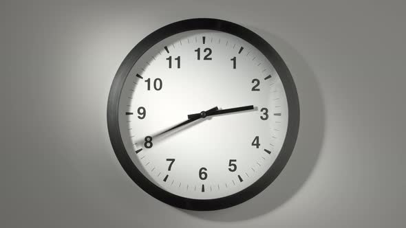 Clock Face In Time Lapse On White Wall 