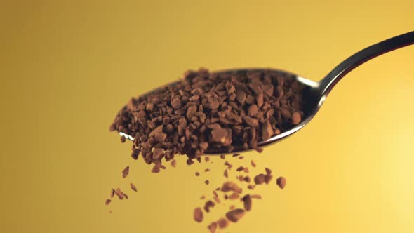 Super Slow Motion with Spoons Falling Pellets of Instant Coffee alt
