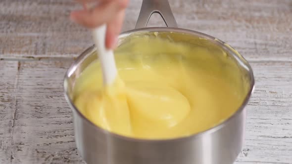Close Up of Custard Cream is Being Stirred in the Pot