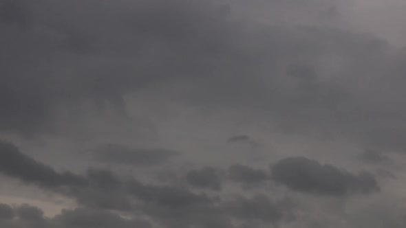 Slow Moving Moody Gathering Storm Clouds In The Sky. Locked Off alt