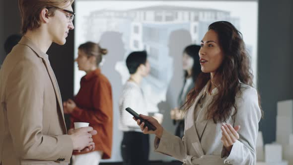 Man and Woman Speaking on Business Event alt