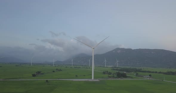  Wind turbine or windmill in a greenfield - Energy Production with clean and Renewable Energy