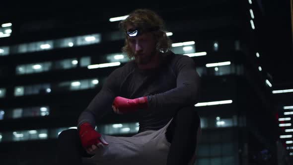 Sporty Caucasian man training on the street alt