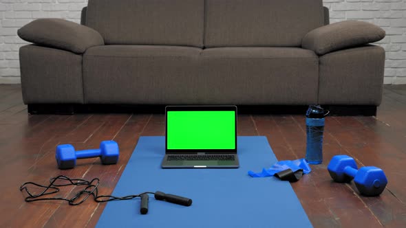 Laptop Display Green Screen Stand on Fitness or Yoga Mat on Home Sofa Background alt