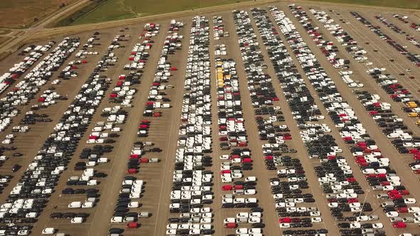 Many new and occasion Cars on a huge parking lot waiting for shipment, Aerial alt