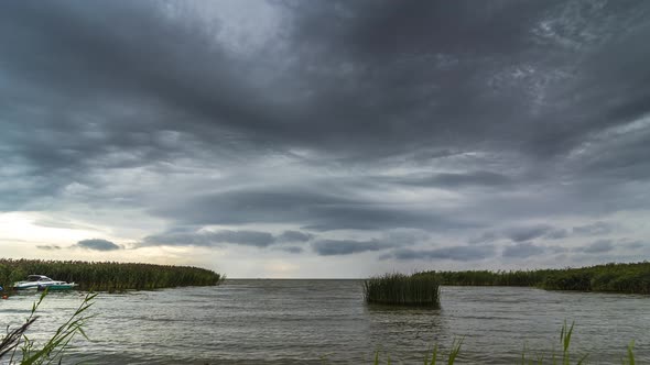 Windy Day with Storm Clouds Above the Lake