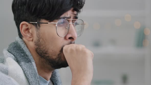 Side View Closeup Male Face Arabic Hispanic Man Wearing Glasses Sits in Plaid Coughing Suffers alt