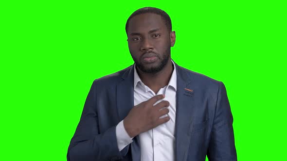 Attractive Businessman Adjusting His Shirt and Suit alt