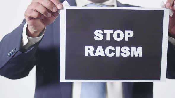 Business Man Posts Sign On Glass Window Stop Racism