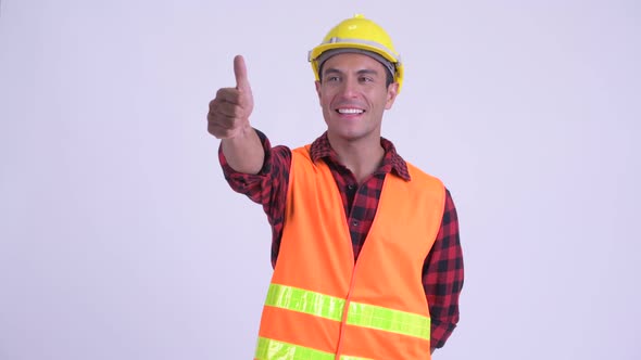 Young Happy Hispanic Man Construction Worker Giving Thumbs Up alt