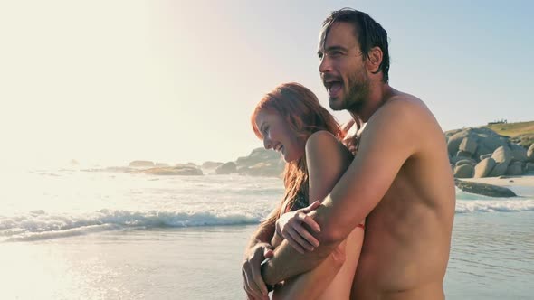 Man embracing woman alt