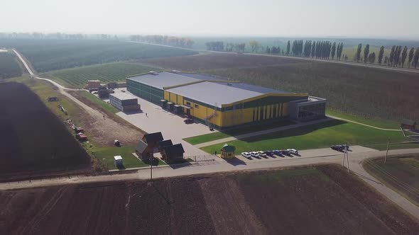 Aerial over fruit orchard farm showing different buildings to warehouse apples and pears alt