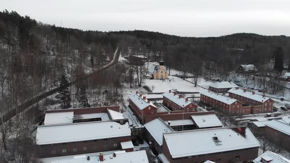 Charming Snowy Town Jonsered Church and Residential Area Aerial Pullback