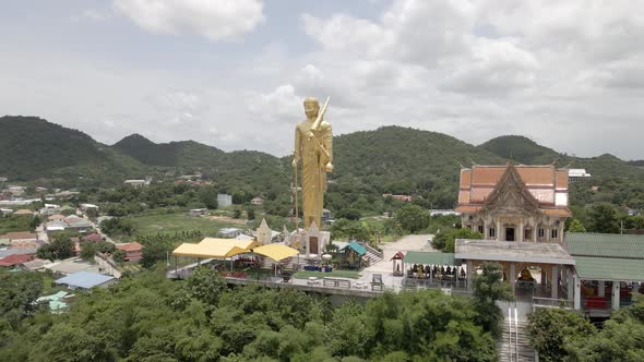 Scenic Landscape of Giant Golden Buddha Standing on Wat Khao Noi Temple, Hua Hin. Thailand alt