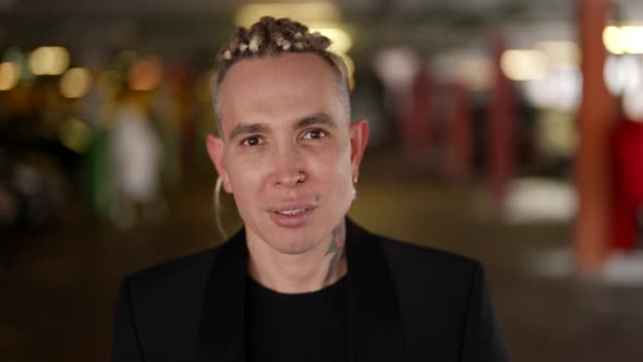 Closeup Portrait of a Cute Homosexual Man in Winter on a Car Parking Lot alt