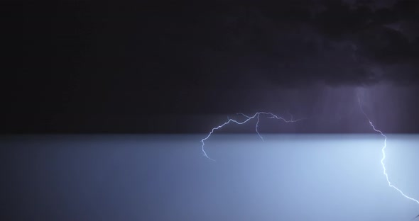 Stormy sky with lightning flashing and thunder. Night thunderstorm clouds.  alt