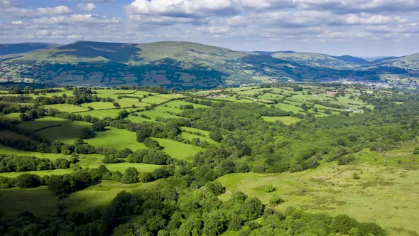 Aerial Hyerlapse of Green Hills and Clouds in Wales alt