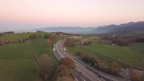 Aerial view of highway interstate road with fast moving traffic in europe. alt