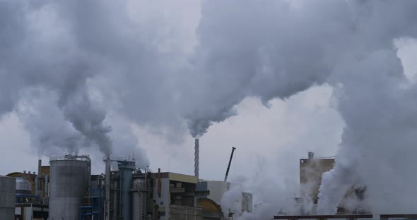 Paper Factory, Tartas, Landes department, France. Water vapor against  a grey sky alt