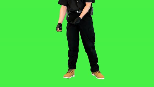 White Policeman Baits a Sheepdog with a Piece of Sugar on a Green Screen Chroma Key alt