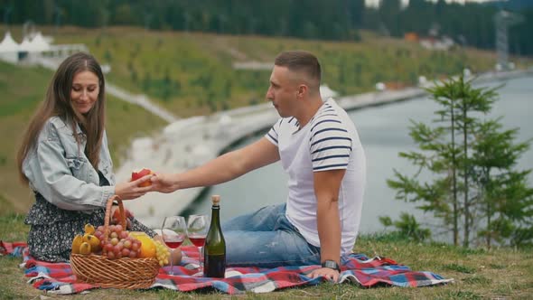 Couple Eating Apples in Nature alt