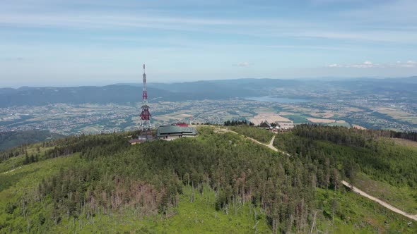 Aerial view of Skrzyczne Hill in Silesian Beskid and Żywieckie lake the background. Szczyrk, Poland. alt