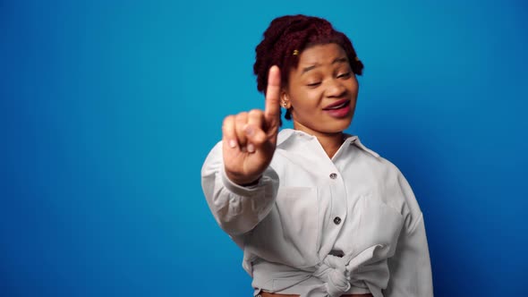 Dissatisfied Afro American Woman Showing Her Refusal Denies Something Against Blue Background