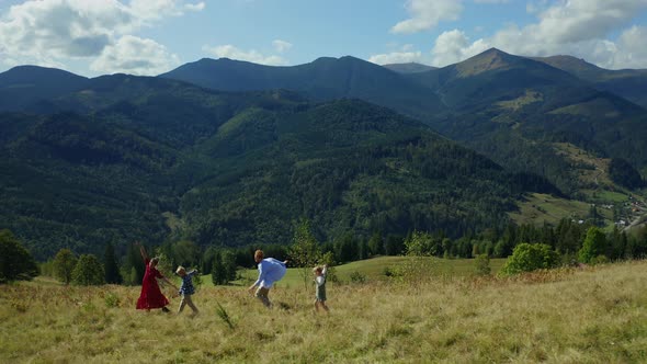 Family Against Mountains Dancing Enjoying Time Looking Green Woods Pikes alt