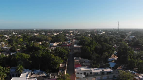 Aerial Panoramic Footage of Town in Tropical Forest