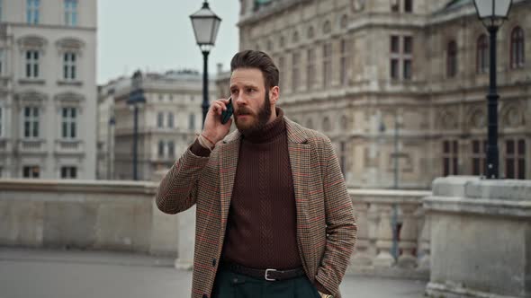 Young Man Using Smartphone with Mobile App alt