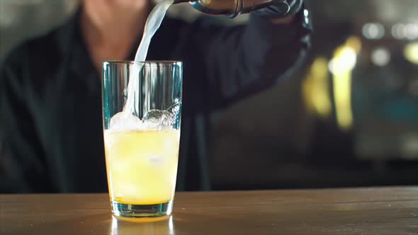 Barman is Making Alcohol Cocktail Closeup