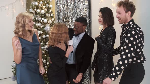 Group of Multiracial Friends Having New Year Party alt