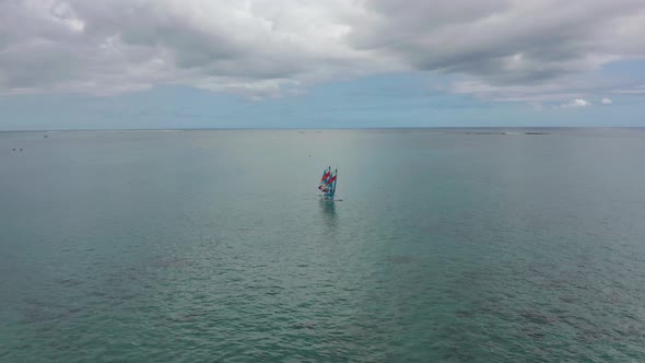 Aerial View of Happy Couple Windsurf Surfing in Calm Deep Blue of Indian Ocean Extreme Summer Sport alt